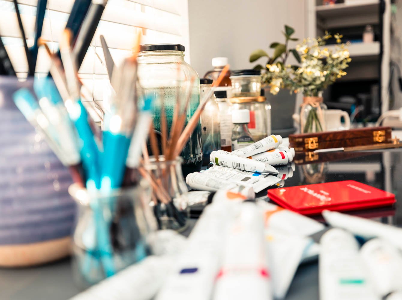 Artist Natalie Bella Studio Closeup with Oil Painting Supplies, Brushes and Paint Tubes