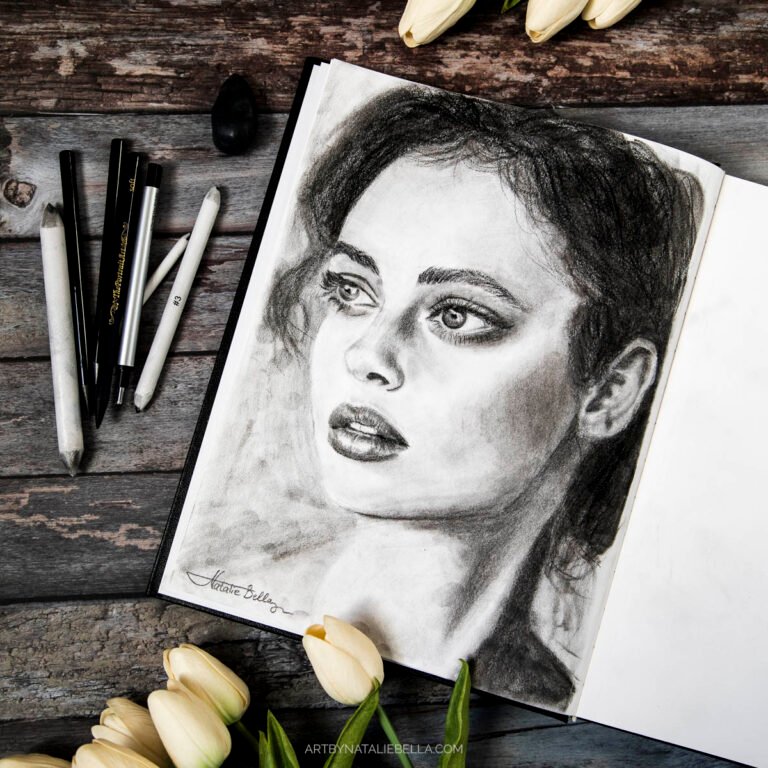 Striking graphite and charcoal portrait of a woman with expressive eyes and detailed features. Beautiful realism in black and white.