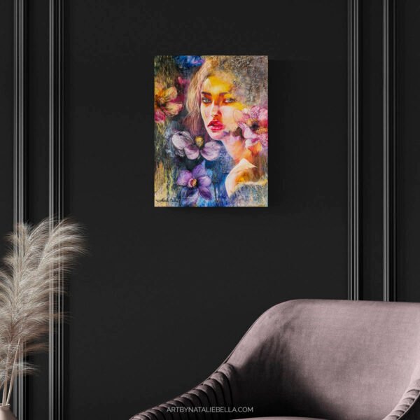 Contemporary mixed media portrait She Chose Light by Natalie Bella displayed on black paneled wall above gray velvet chair with pampas grass decor - original oil painting with textured flowers and golden light for sophisticated home interiors
