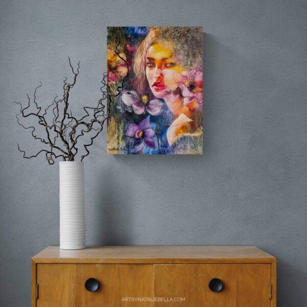 Original oil and mixed media portrait She Chose Light by Natalie Bella displayed above mid-century modern wood credenza with white ceramic vase and branches - contemporary floral art for home styling and interior design