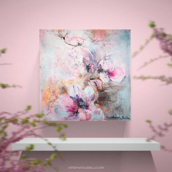 Where Light Lingers - Contemporary Pink Blossom Painting in Soft Original mixed media floral painting featuring pink and purple blossoms with gold leaf on canvas, displayed on white floating shelf against blush pink wall with cherry blossom branches