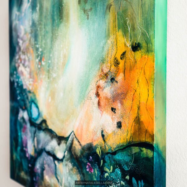 Awakening - Orange and Teal Abstract Painting Side View by Natal Angled side view of Awakening showing warm orange and gold tones contrasting with deep teal, and the painted canvas edge, in an original 24x24 mixed media abstract painting by Natalie Bella