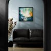 Awakening - Teal Abstract Painting in Dark Elegant Interior by N Original 24x24 teal abstract painting Awakening by Natalie Bella in a black float frame above a leather sofa, framed by a dramatic black arch doorway in a sophisticated contemporary interior