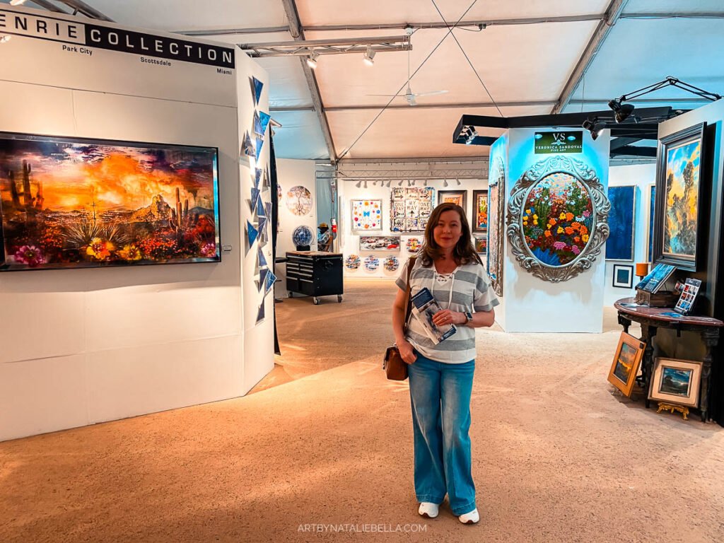Inside the Celebration of Fine Art Show in Scottsdate AZ, January 2026. Artist Natalie Bella. In the background: Cary Henrie and Veronica & Gabriel Sandoval