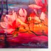 Close-up of Coastal Grace featuring warm coral and pink floral blooms with rich orange and red tones against purple-blue water reflections