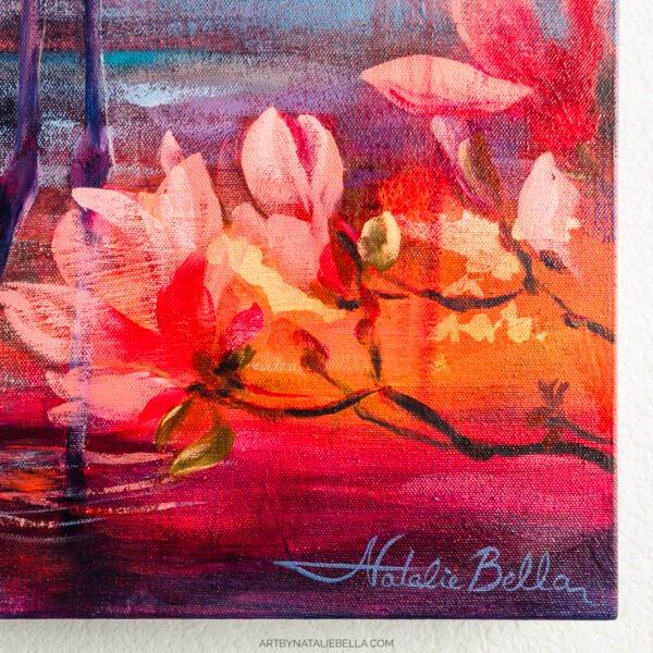 Close-up of Coastal Grace featuring warm coral and pink floral blooms with rich orange and red tones against purple-blue water reflections